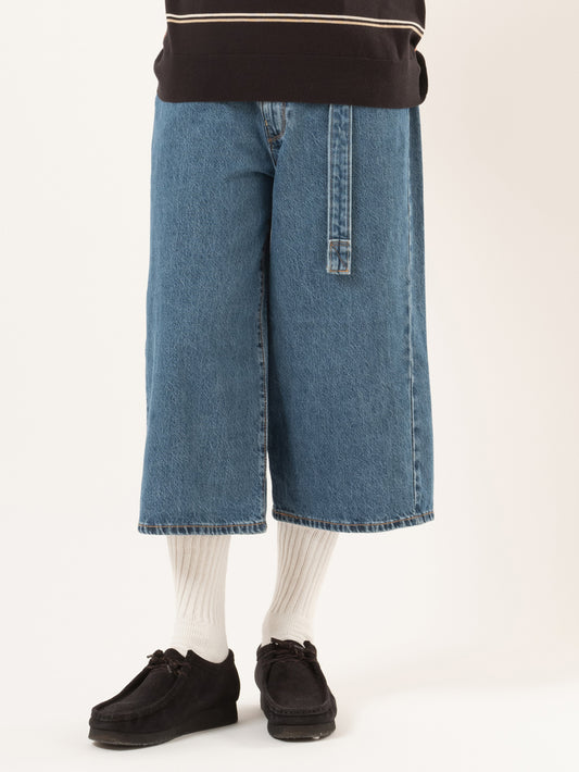 ツイステッド バギージーンズ カプリ ミディアムインディゴ